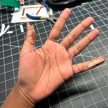 I used tape to secure the thread on the fingers.