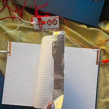 I experimented with using the action of turning a page as a button.