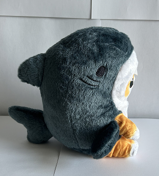 Side view of my second complex object, a cat in a shark costume plush.